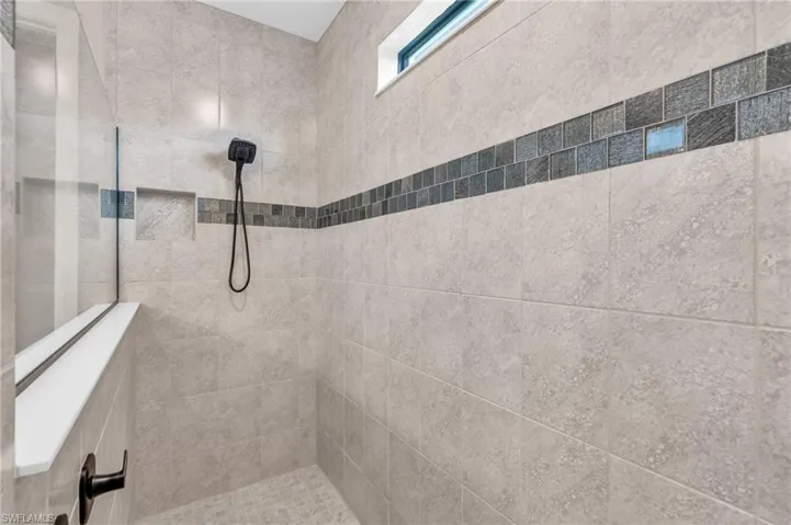 Bathroom featuring an extra large tile shower w/Rainfall Shower above