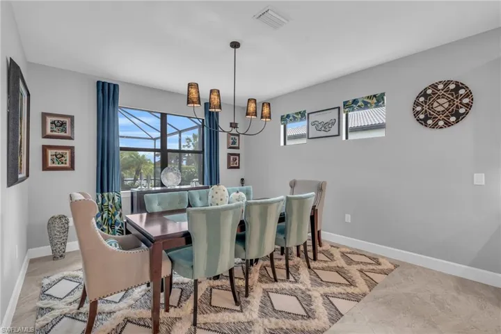 Dining area with an inviting chandelier