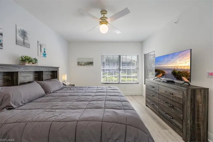Bedroom with light wood-type flooring and ceiling fan
