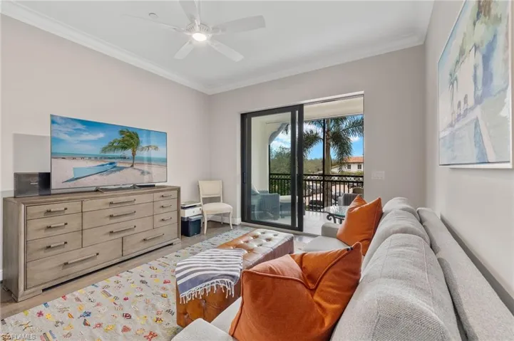 Study/Den with wood plank flooring, a ceiling fan, crown molding, and access to its own lanai.