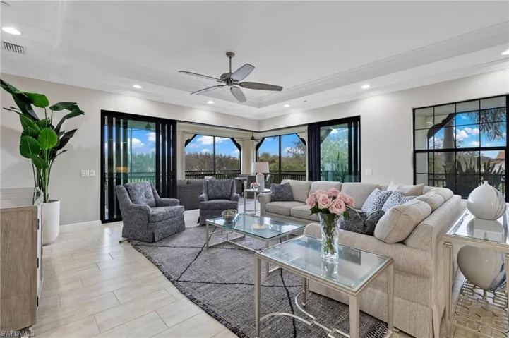 Great Room area with crown molding, recessed lighting, and a ceiling fan.