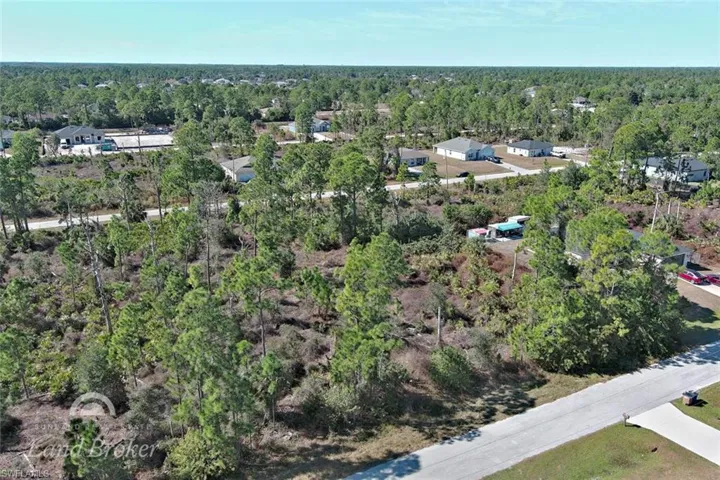 View of property location with nearby suburban area