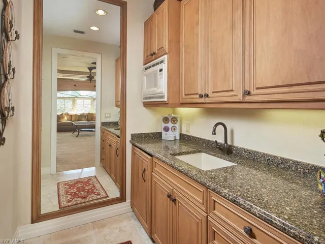 Small kitchenette with sink and microwave - the perfect space for your guests to enjoy.