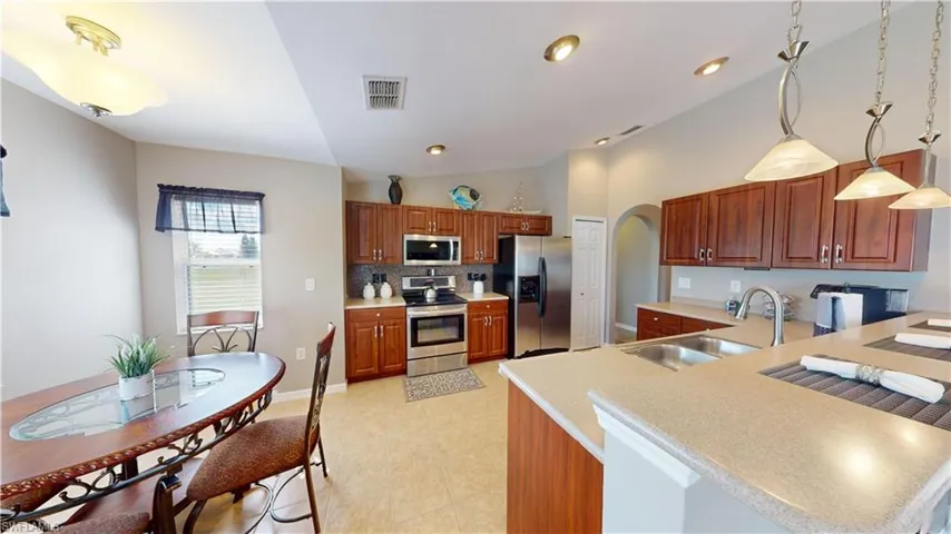 Eat-in kitchen with lots of light, cabinets, counters