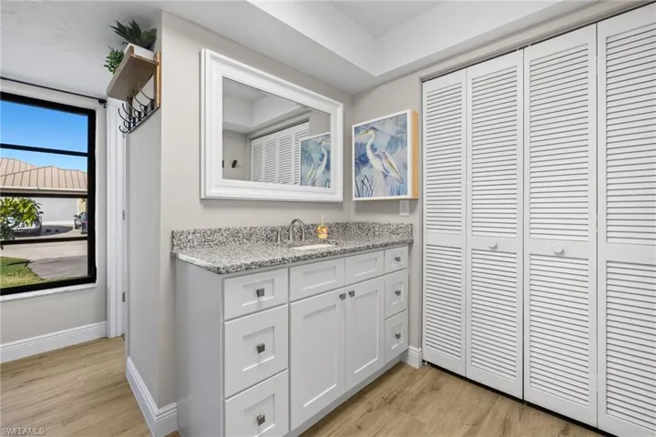 Bathroom featuring hardwood / wood-style floors and vanity