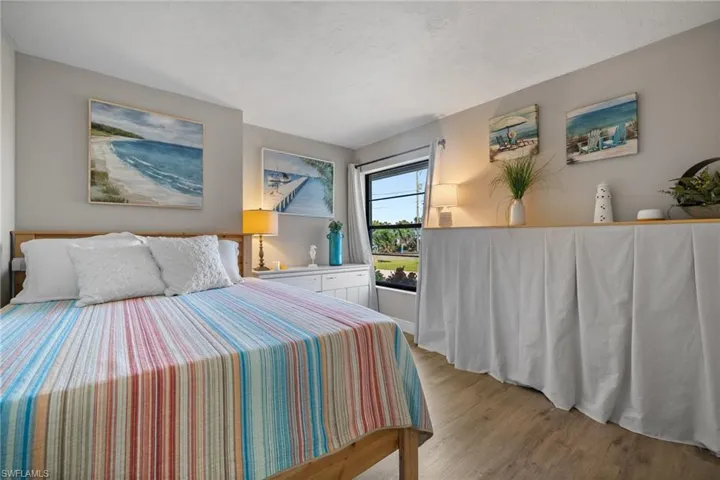 Bedroom with light hardwood / wood-style floors