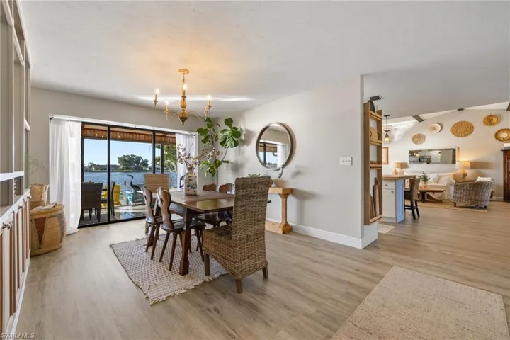 Dining space with a chandelier and light hardwood / wood-style floors