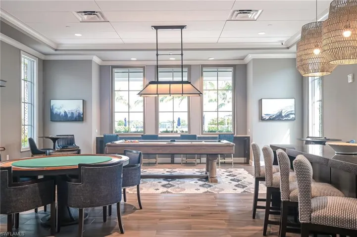 Playroom featuring crown molding, plenty of natural light, and recessed lighting