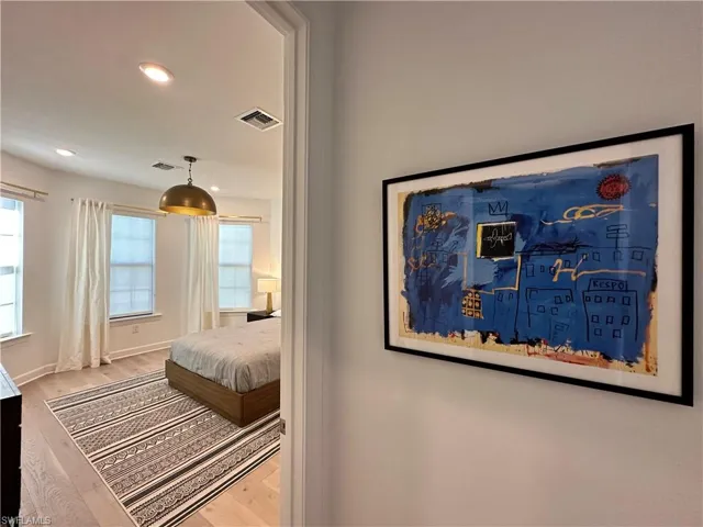 Bedroom with recessed lighting and light wood-style floors