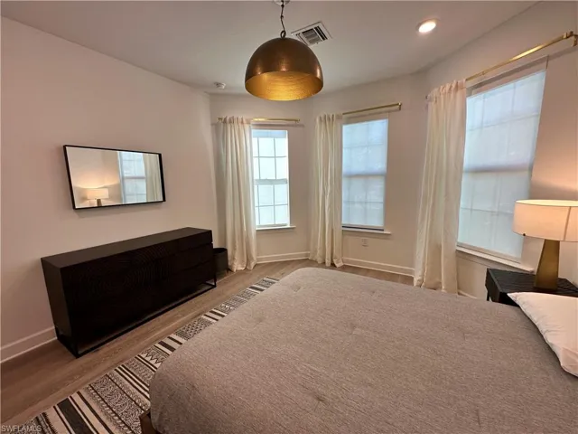 Bedroom featuring wood finished floors and recessed lighting