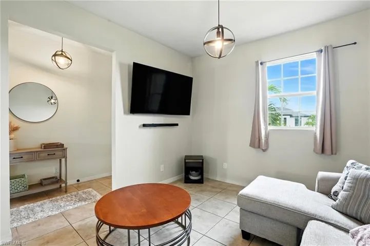 Living room featuring light tile patterned floors
