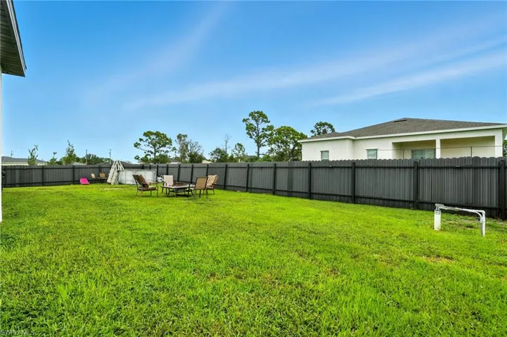 View of fenced backyard
