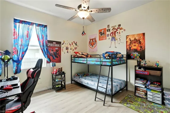 Bedroom with light wood-type flooring and ceiling fan