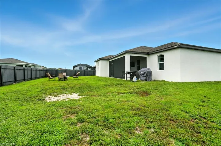 View of fenced backyard