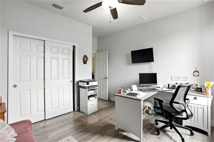 Office featuring light wood finished floors and ceiling fan
