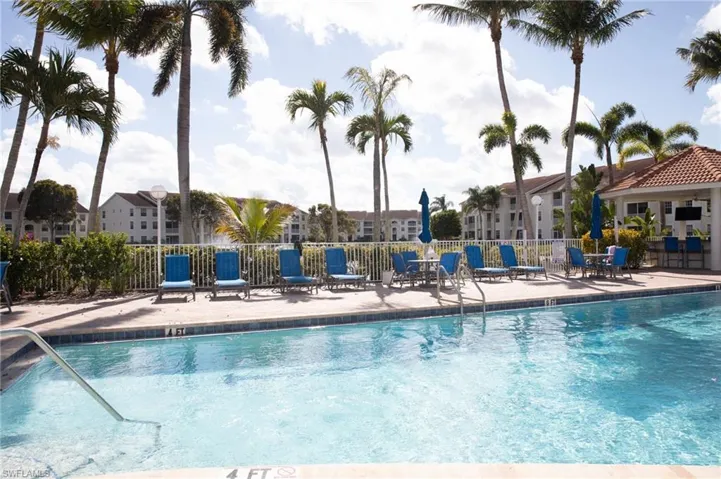 Community pool with a patio area