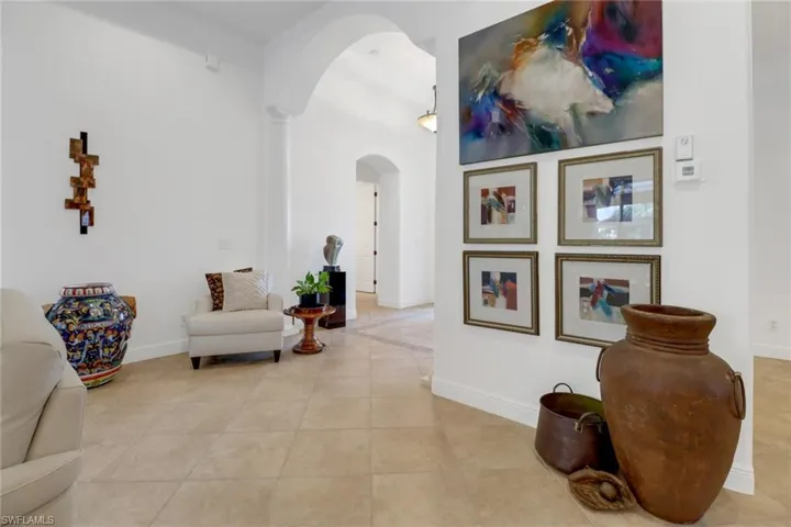 Corridor with light tile patterned flooring