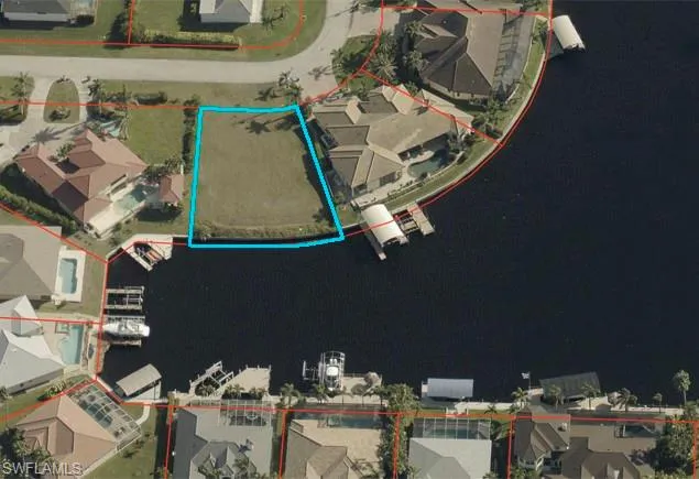 Aerial view of residential area with property parcel outlined