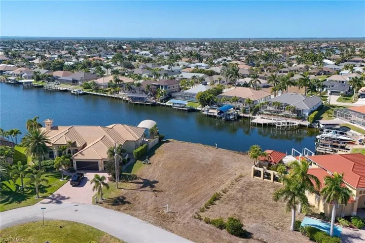 Aerial perspective of suburban area with a large body of water