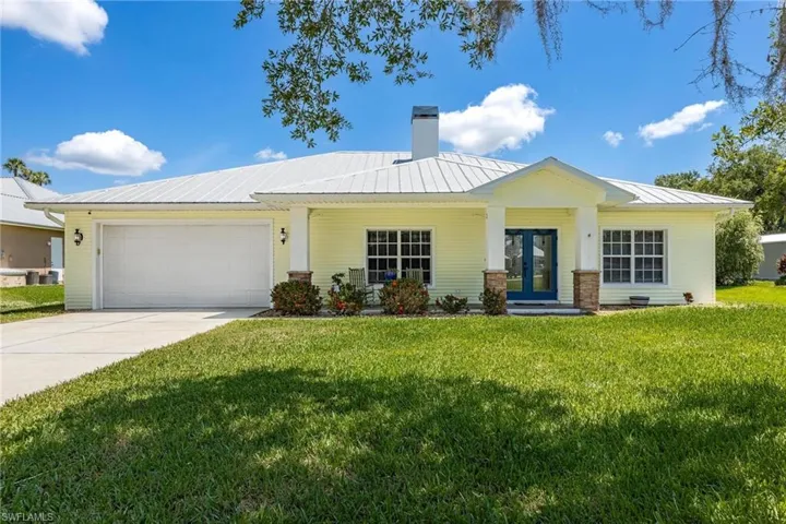 View of front of home with attached 2 car garage.