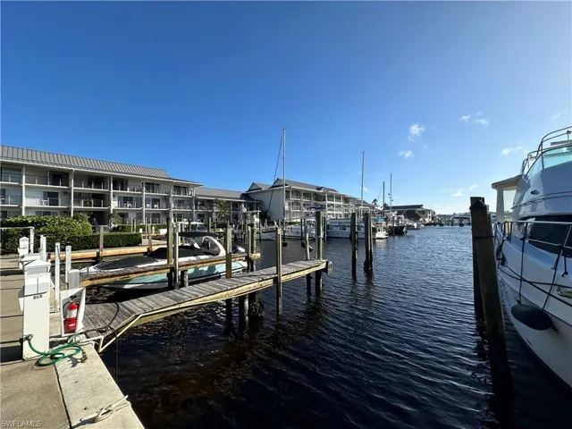 Dock area featuring a water view
