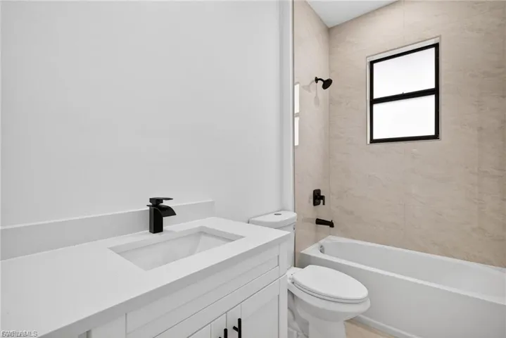 Full bathroom featuring vanity and bathing tub / shower combination