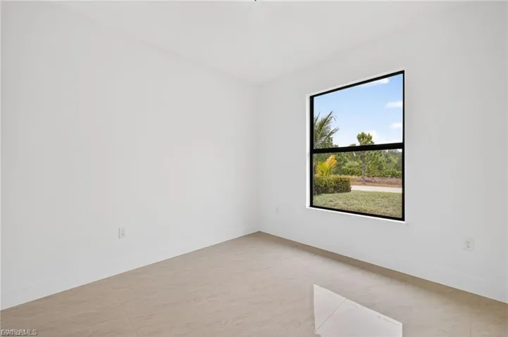 Unfurnished room with baseboards