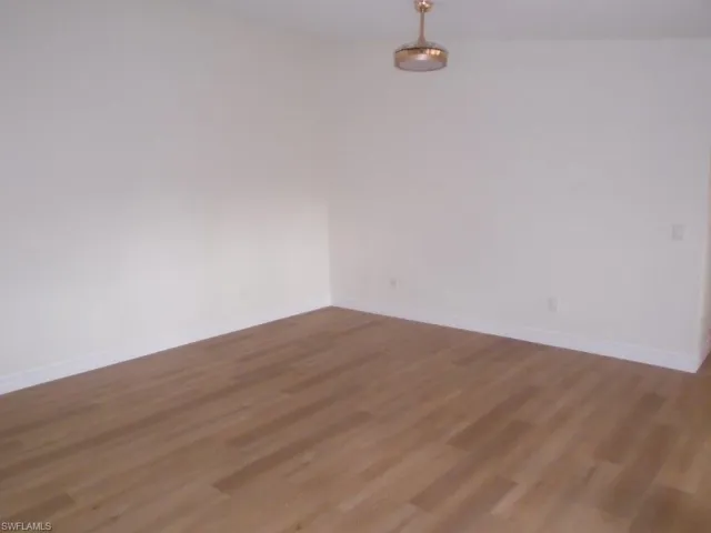 Spare room with hardwood / wood-style flooring