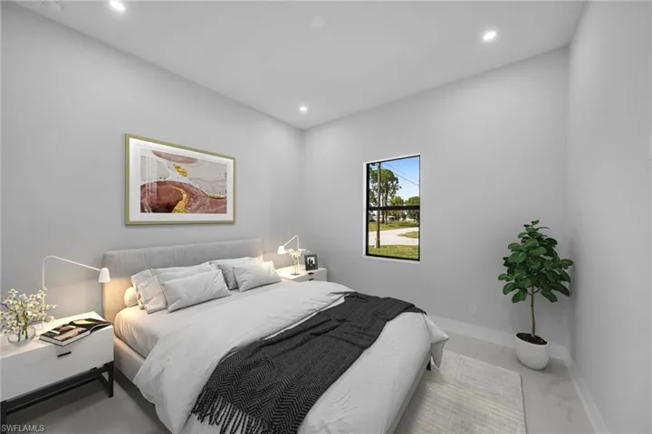 Interior space featuring neutral wall paint, recessed lighting, polished flooring, and a window with a dark frame