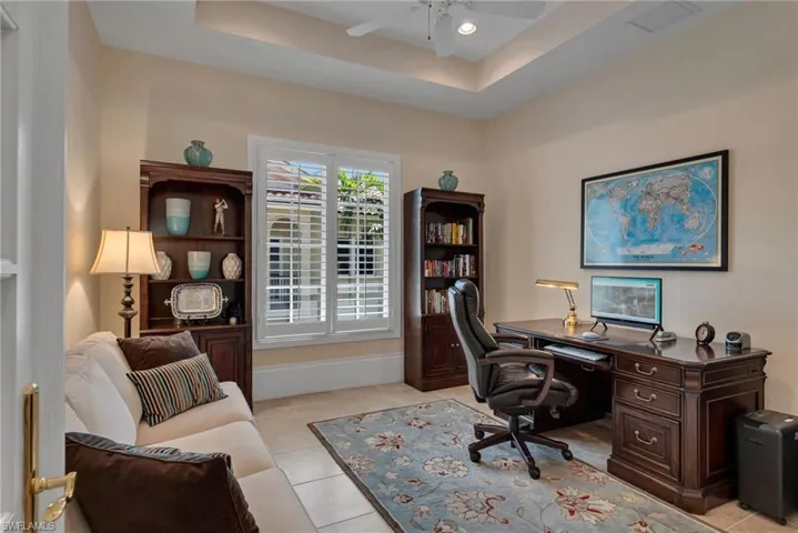 Large den that can be used as an office, or a bedroom, as the sleeper sofa holds a comfortable air mattress, and the glass, French doors already have coverings for privacy.