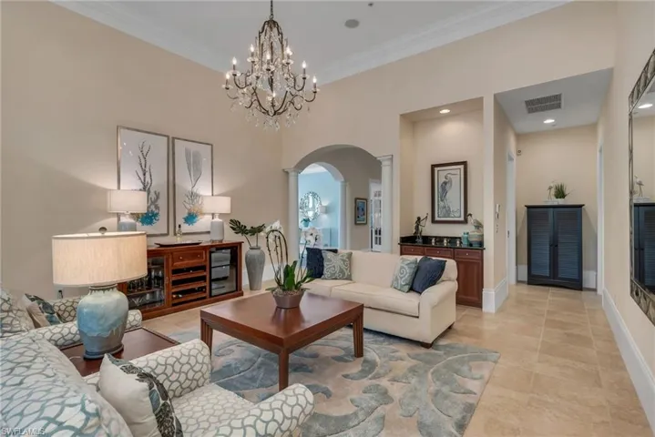 The living room is the perfect gathering place before dinner, with a guest bath and ensuite bedroom down the hallway.