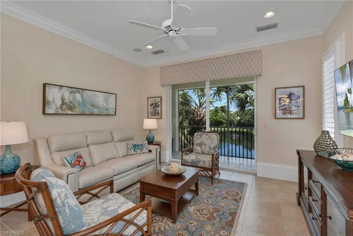 The family room is just off the kitchen, with tranquil, lake views.