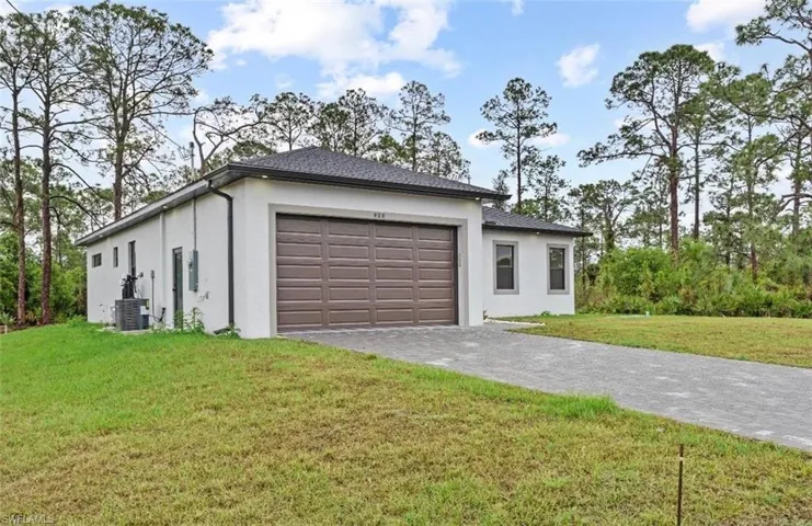 Garage featuring driveway