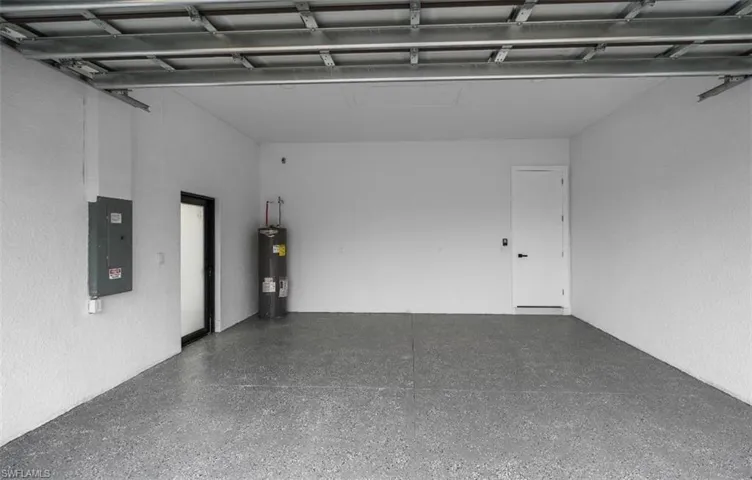 Garage with electric panel and electric water heater