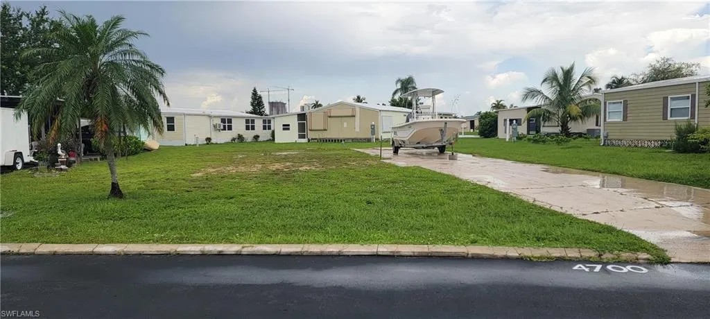 View of property with a front yard