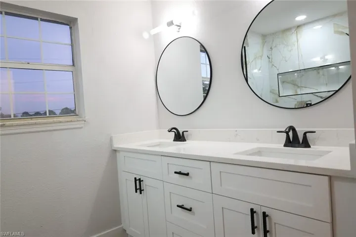 Bathroom featuring double vanity