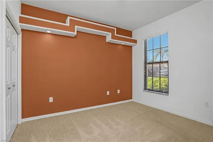 Primary bathroom with dual vanities, soaking tub, and separate walk-in shower.