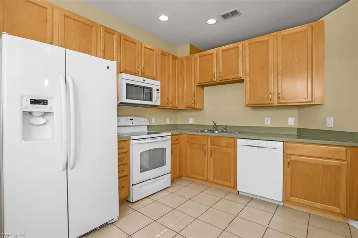 Roomy eat-in kitchen has enough space for a table and plenty of cabinet storage space.