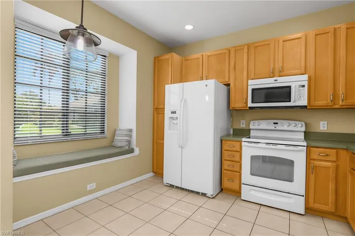 Eat-in kitchen also includes charming window bench for additional seating.