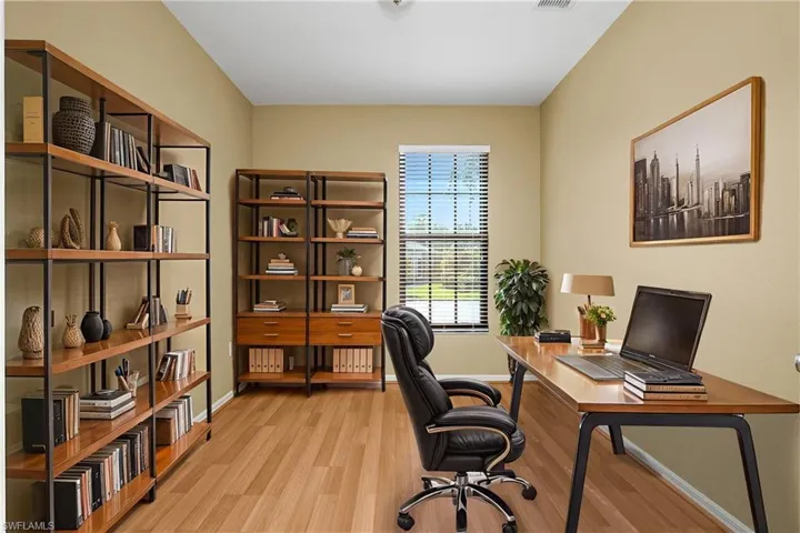 Versatile flex room features french doors and can be utilized as a den, office or third bedroom. *furnishings are digitally staged.