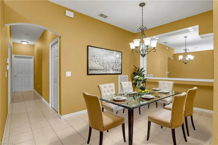 Dedicated formal dining room is just off kitchen and great room. *furnishings are digitally staged.