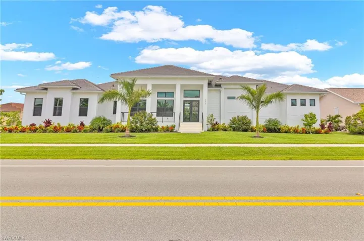 Mediterranean / spanish home featuring a front yard