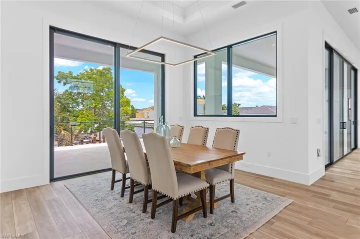 Dining room with light hardwood / wood-style floors