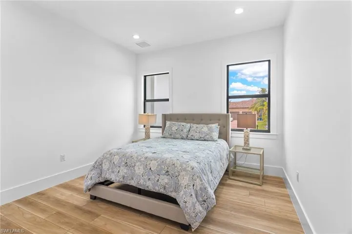 Bedroom with light hardwood / wood-style floors