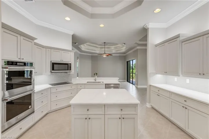 Tray ceiling,crown molding, tile backsplash, new stainless appliances