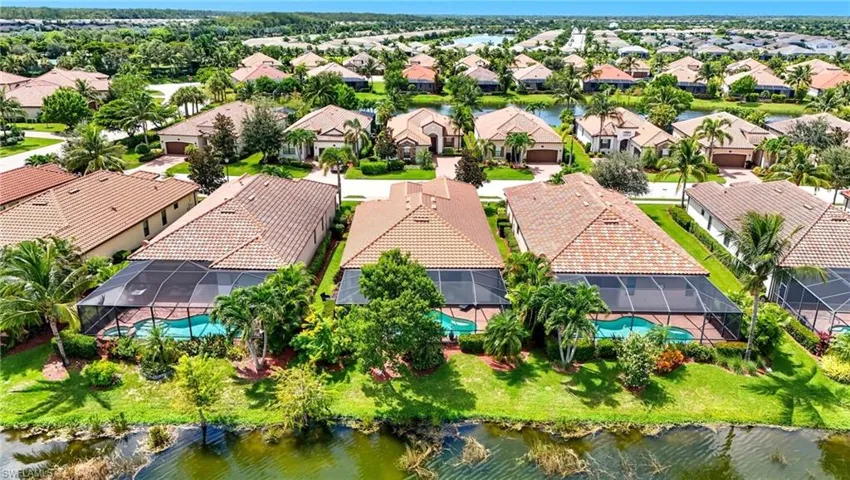 Aerial perspective of suburban area with a large body of water