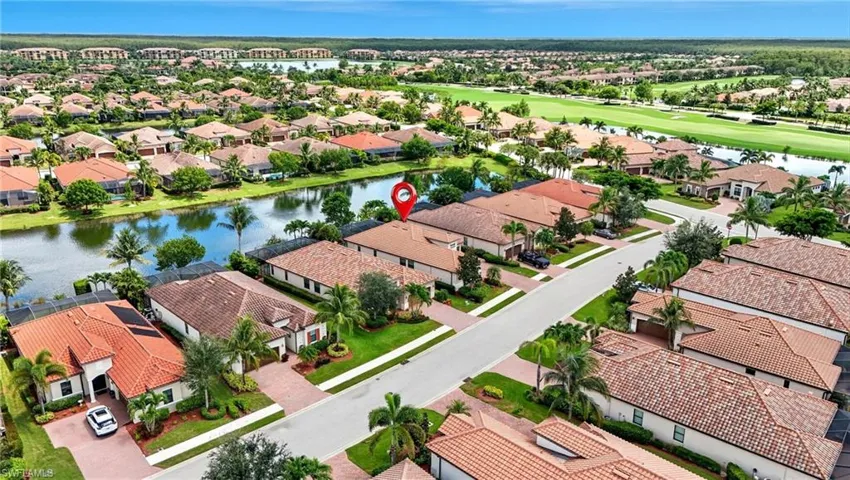 Aerial view of residential area with a nearby body of water