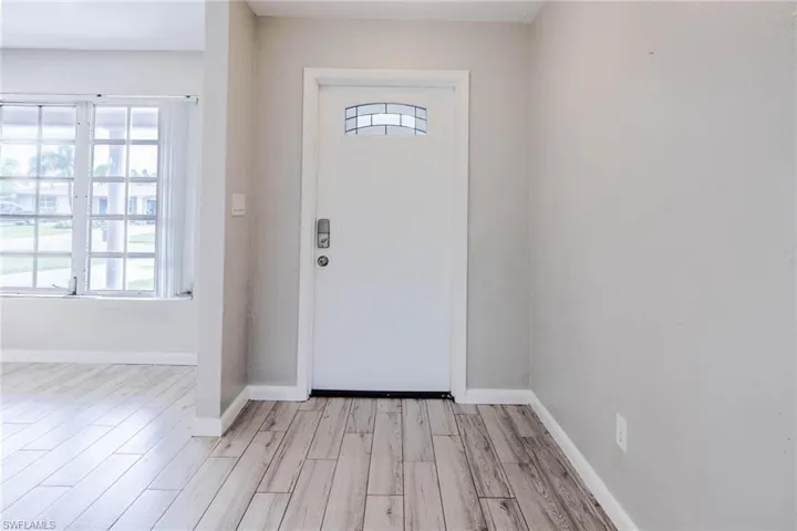Foyer with light wood-type flooring