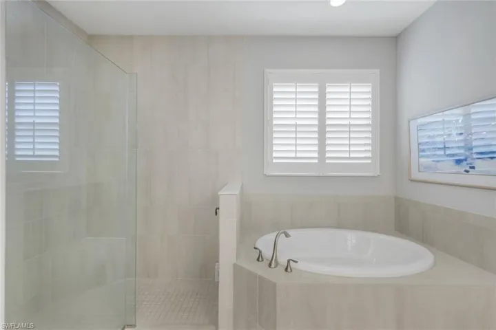 Bathroom with shower with separate bathtub