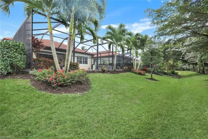 View of yard with a lanai